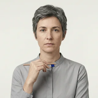 Marguerite Oyelaran, holding a pencil