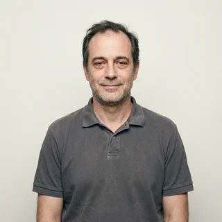 Employee-style portrait of a middle-aged driver in a polo shirt