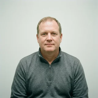 Dale Vercammen, photographed against a plain clinical backdrop.