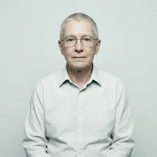 Terrence Obuya, photographed against a plain clinical backdrop.